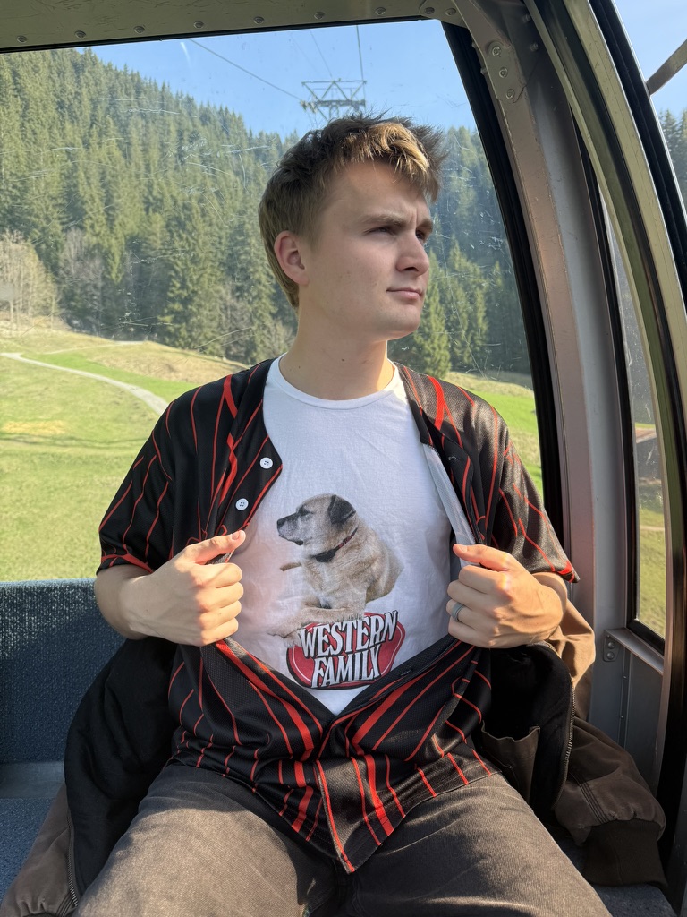 Austin in a gondola in the mountains